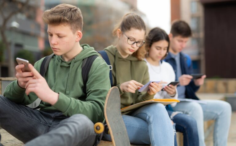 Teenage,Friends,Spending,Time,Together,On,Streets,Of,City,,Messaging